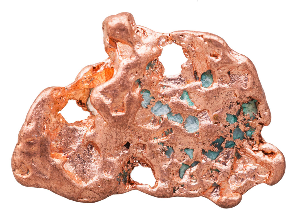 A raw piece of copper against a white background in El Paso.
